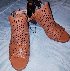 Woven peep toe sandals.